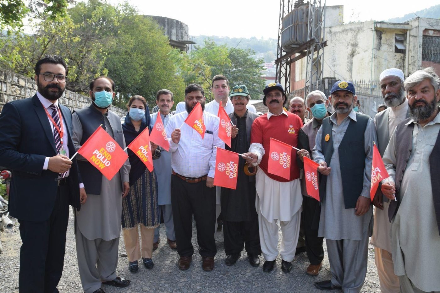 Rotarians waving End Polio Now flags during the End Polio Million March