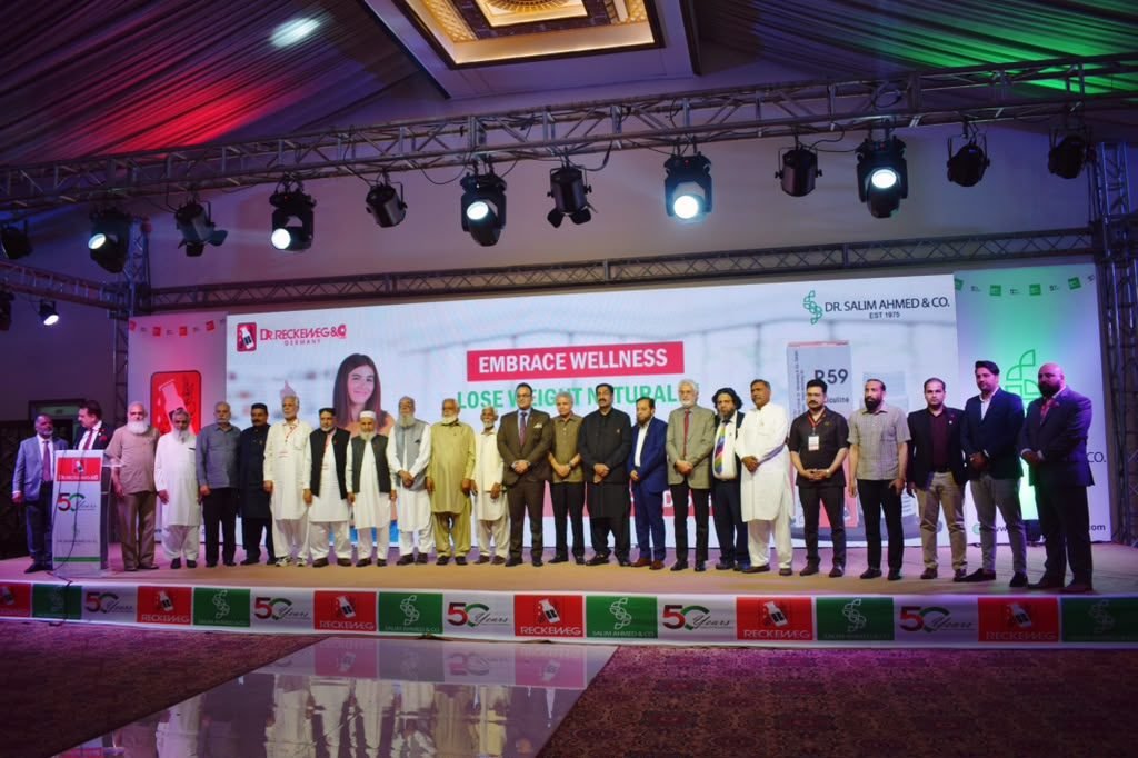 Guests on stage at the 50 years celebration of Dr. Salim Ahmed and Co. and Dr. Reckeweg